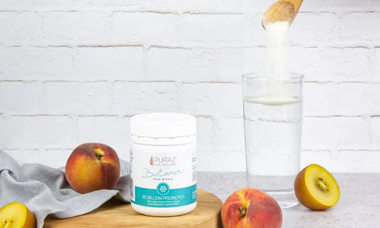 Probiotic supplement with yoghurt and fermented foods on a kitchen bench