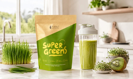 Puraz Super Greens pouch with a glass of pineapple greens powder and fresh NZ grown greens