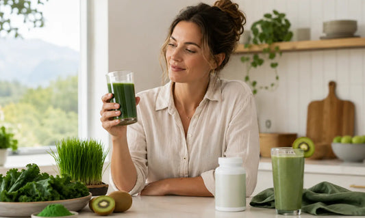 Puraz Super Greens powder beside a multivitamin bottle, leafy greens, kiwifruit and a smoothie for a greens powder vs multivitamin guide