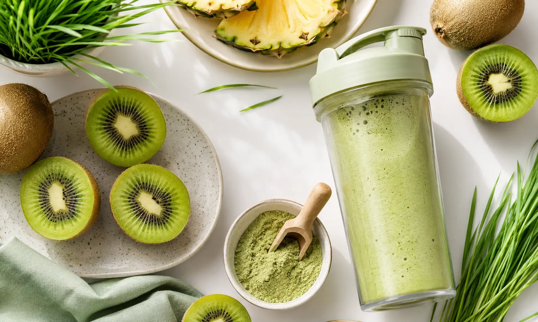 Fresh kiwifruit, green superfood powder and a pineapple smoothie for a Puraz daily greens routine