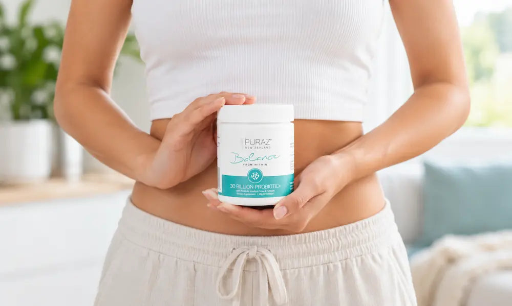 Puraz Probiotic+ powder beside water and a smoothie for a probiotic for bloating NZ shopping guide