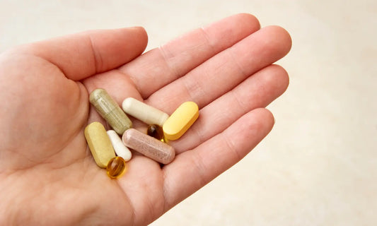 Person pausing before mixing a sleep supplement at bedtime while checking a safety list for medication, pregnancy, alcohol and supplement stacking.