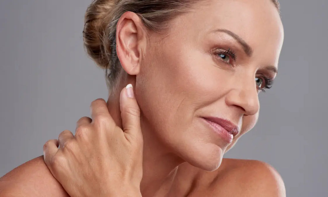 Woman with healthy natural skin in soft light representing skin longevity and long-term skin resilience